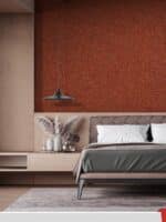 Ein gemütliches und stilvolles Schlafzimmer mit Wänden, die mit der Belka Tapete Kupfer bedeckt sind.